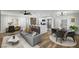 A bright and open living room and kitchen combo featuring stylish decor and modern appliances at 4804 El Tesoro Ave, Las Vegas, NV 89121