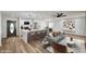 A bright and modern open-concept living room and kitchen with updated appliances at 4804 El Tesoro Ave, Las Vegas, NV 89121