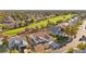 Aerial view of a house featuring desert landscaping and community golf course at 5009 Elm Grove Dr, Las Vegas, NV 89130