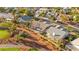 Aerial view of a home with desert landscaping, solar panels and a community golf course at 5009 Elm Grove Dr, Las Vegas, NV 89130
