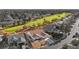 Aerial view of a home featuring desert landscaping, solar panels and a nearby golf course at 5009 Elm Grove Dr, Las Vegas, NV 89130