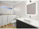 Bathroom featuring a soaking tub, toilet, vanity and a large illuminated mirror at 5009 Elm Grove Dr, Las Vegas, NV 89130