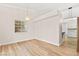 Dining room with a modern chandelier, wood-style flooring, and natural light at 5009 Elm Grove Dr, Las Vegas, NV 89130