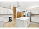 Bright kitchen featuring a center island, tile backsplash, and stainless steel appliances at 5009 Elm Grove Dr, Las Vegas, NV 89130