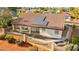 Inviting home featuring a terracotta roof, solar panels, and a charming covered patio with columns at 5009 Elm Grove Dr, Las Vegas, NV 89130
