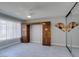 Bedroom with unique wardrobe, ceiling fan, window, and tiled floor at 5049 Lancaster Dr, Las Vegas, NV 89120