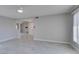 Spacious living room with light gray tile floor and lots of natural light at 5049 Lancaster Dr, Las Vegas, NV 89120