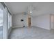 Living room featuring vaulted ceiling, large window, and light gray tile floor at 5049 Lancaster Dr, Las Vegas, NV 89120