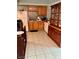 Functional kitchen featuring wooden cabinets and tile flooring at 5201 Glen Eagles Ln, Las Vegas, NV 89108