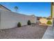 Spacious backyard with rock landscaping and perimeter fencing at 602 Paloma Dr, Boulder City, NV 89005
