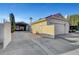 Spacious driveway, parking area, and a covered metal storage building at the rear of the property at 602 Paloma Dr, Boulder City, NV 89005