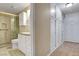 Well-lit bathroom featuring a tiled shower, vanity, and ample storage cabinets at 602 Paloma Dr, Boulder City, NV 89005