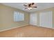 Bedroom featuring wood-look floors, a ceiling fan and a double door closet at 602 Paloma Dr, Boulder City, NV 89005