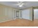 Spacious bedroom with wood floors, a ceiling fan, and ample closet space with bright, natural light at 602 Paloma Dr, Boulder City, NV 89005