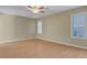 Bedroom with wood-look floors, ceiling fan, and two windows with shutters at 602 Paloma Dr, Boulder City, NV 89005