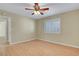 Cozy bedroom featuring wood floors, a ceiling fan, neutral walls, and shuttered windows for natural light at 602 Paloma Dr, Boulder City, NV 89005