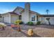 Well-kept home exterior featuring desert landscaping and a charming stucco facade at 602 Paloma Dr, Boulder City, NV 89005