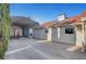 View of the home's exterior, including the metal awning covered parking area and access to the backyard at 602 Paloma Dr, Boulder City, NV 89005