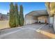 Covered parking and storage area behind the home with a secure cinder block wall at 602 Paloma Dr, Boulder City, NV 89005