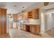 Spacious kitchen with ample wood cabinetry, modern appliances, and tiled backsplash at 602 Paloma Dr, Boulder City, NV 89005