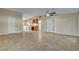 Open-concept living area featuring neutral paint, tile floors, and a view of the kitchen at 602 Paloma Dr, Boulder City, NV 89005