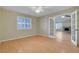 Room with wood-look floors, ceiling fan and french doors to a separate living space at 602 Paloma Dr, Boulder City, NV 89005