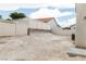 The home has a large backyard with a fence, ready for landscaping at 629 Bright Lights Ave, North Las Vegas, NV 89031