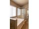 Bright bathroom featuring a tub with shower and tile flooring, creating a clean and inviting space at 629 Bright Lights Ave, North Las Vegas, NV 89031