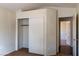 Bedroom featuring a closet with sliding doors and a view of an adjacent room at 629 Bright Lights Ave, North Las Vegas, NV 89031