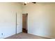 This bedroom features carpet floors, a ceiling fan and an interior door leading outside the room at 629 Bright Lights Ave, North Las Vegas, NV 89031