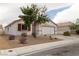Inviting single-story home showcasing a red tile roof, neutral stucco, and a two-car garage at 629 Bright Lights Ave, North Las Vegas, NV 89031