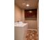 Functional laundry room with washer, dryer, and upper cabinets for storage solutions at 629 Bright Lights Ave, North Las Vegas, NV 89031