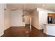 Open-concept living space with seamless transition to the kitchen, featuring hardwood floors at 629 Bright Lights Ave, North Las Vegas, NV 89031