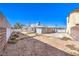 Backyard featuring a lattice-covered patio, gray exterior paint, and a cinder block privacy fence at 6741 Bonillo Dr, Las Vegas, NV 89103