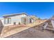 Backyard featuring a lattice-covered patio, gray exterior paint, and a cinder block privacy fence at 6741 Bonillo Dr, Las Vegas, NV 89103