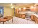 Traditional kitchen features wood cabinets, white countertops, and stainless steel appliances at 6741 Bonillo Dr, Las Vegas, NV 89103