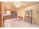 Open kitchen featuring wooden cabinets, tile flooring, and stainless steel appliances for a practical cooking experience at 6741 Bonillo Dr, Las Vegas, NV 89103