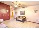 Comfortable living area with tile flooring, complemented by a neutral color scheme and bright accent wall at 6741 Bonillo Dr, Las Vegas, NV 89103