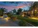 Expansive backyard featuring a putting green, lush landscaping, and a cozy outdoor seating area at 7600 Pleasant Colony Ct, Las Vegas, NV 89131