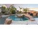 Luxurious custom pool with rock features, a spa, and a water slide at 7600 Pleasant Colony Ct, Las Vegas, NV 89131