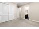 Neutral bedroom showcasing closet with sliding doors and open doorway to an ensuite bathroom at 7763 Brisk Ocean Ave, Las Vegas, NV 89178