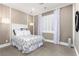 Charming bedroom featuring soft lighting, plush carpeting, and detailed wall trim for a serene ambiance at 7763 Brisk Ocean Ave, Las Vegas, NV 89178