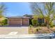 Charming single-story home with a three-car garage and well-manicured landscaping at 7763 Brisk Ocean Ave, Las Vegas, NV 89178