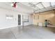 Spacious garage featuring organized storage cabinets and a clean, epoxy-coated floor at 7763 Brisk Ocean Ave, Las Vegas, NV 89178