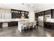 Gourmet kitchen showcasing dark cabinets, granite countertops, and stainless steel appliances at 7763 Brisk Ocean Ave, Las Vegas, NV 89178