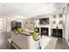 Bright and airy living room with a fireplace, built-in shelving, and hardwood floors at 7763 Brisk Ocean Ave, Las Vegas, NV 89178