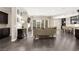 Spacious open-concept living area showcases hardwood flooring and seamlessly connects living room and kitchen at 7763 Brisk Ocean Ave, Las Vegas, NV 89178