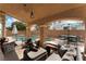 Serene backyard featuring a pool, spa, covered patio, and comfortable lounge area at 7837 Silver Plateau Ave, Las Vegas, NV 89128