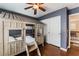 Bedroom features hardwood floors, shutters, built-in bunk beds, and a sliding closet at 7837 Silver Plateau Ave, Las Vegas, NV 89128