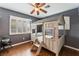 Bedroom features hardwood floors, shuttered windows, and a novelty wooden bunk bed with ladder at 7837 Silver Plateau Ave, Las Vegas, NV 89128